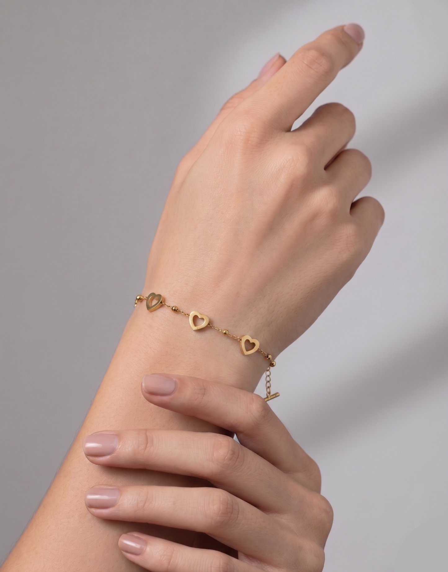 
                  
                    Women's Dainty Gold Bracelet with Heart Charms - Stainless Steel/Silver T-Bar Adjustable Heart Outline Chain Layering Bracelet
                  
                